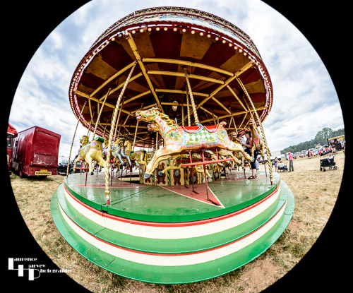Steam powered carousel seen through a fisheye lens